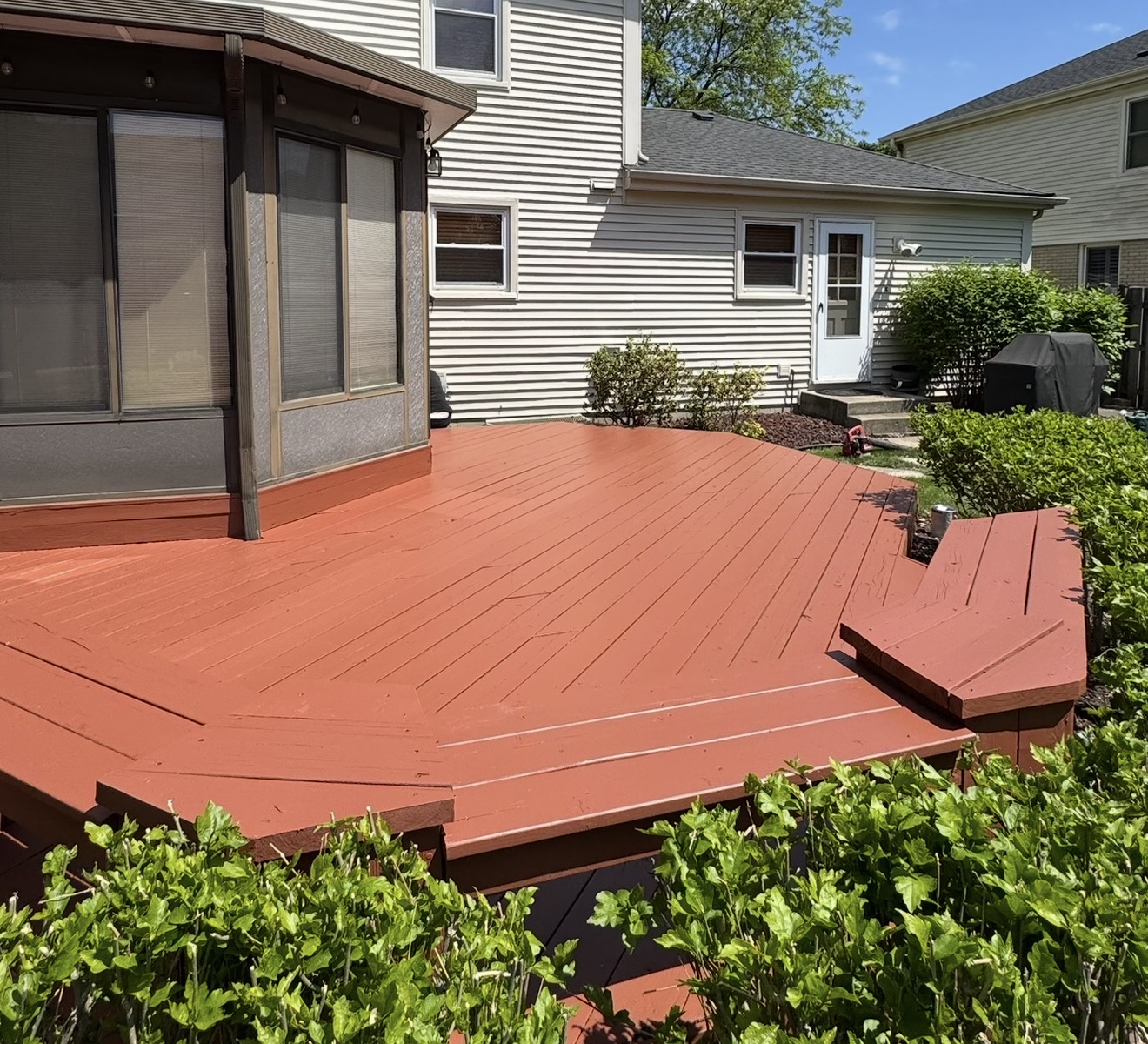 Cedar deck after restoration — warm honey stain